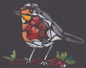 An image of a robin standing on a twig with berries
